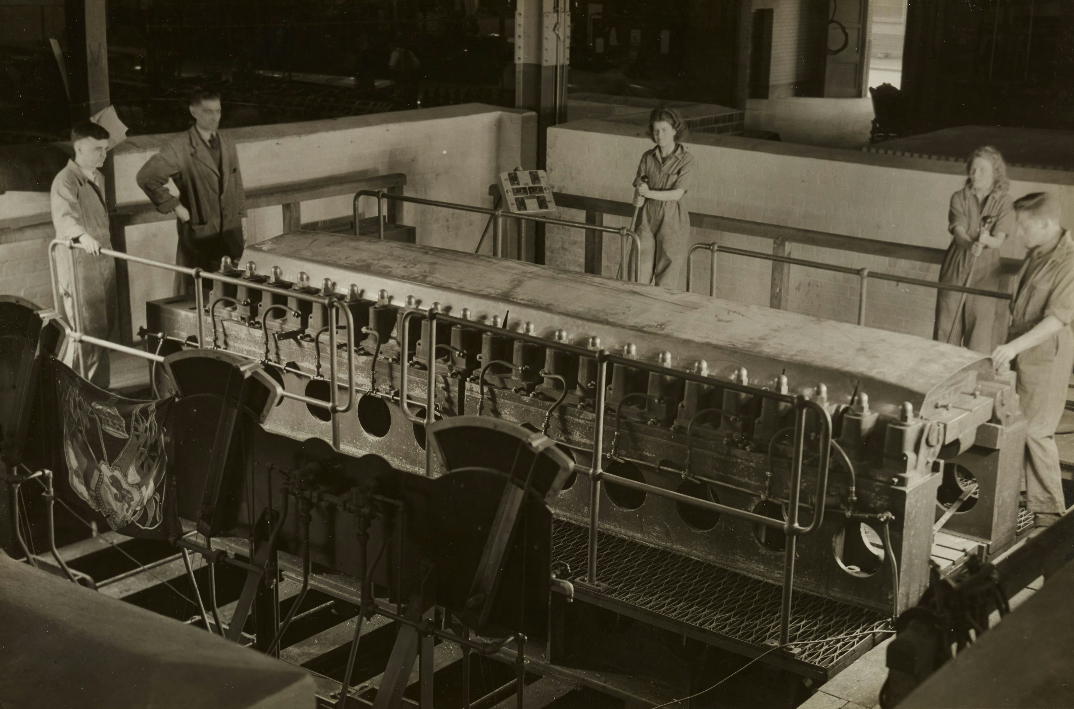 Workers on a production line for a custom yoga bra manufacturer