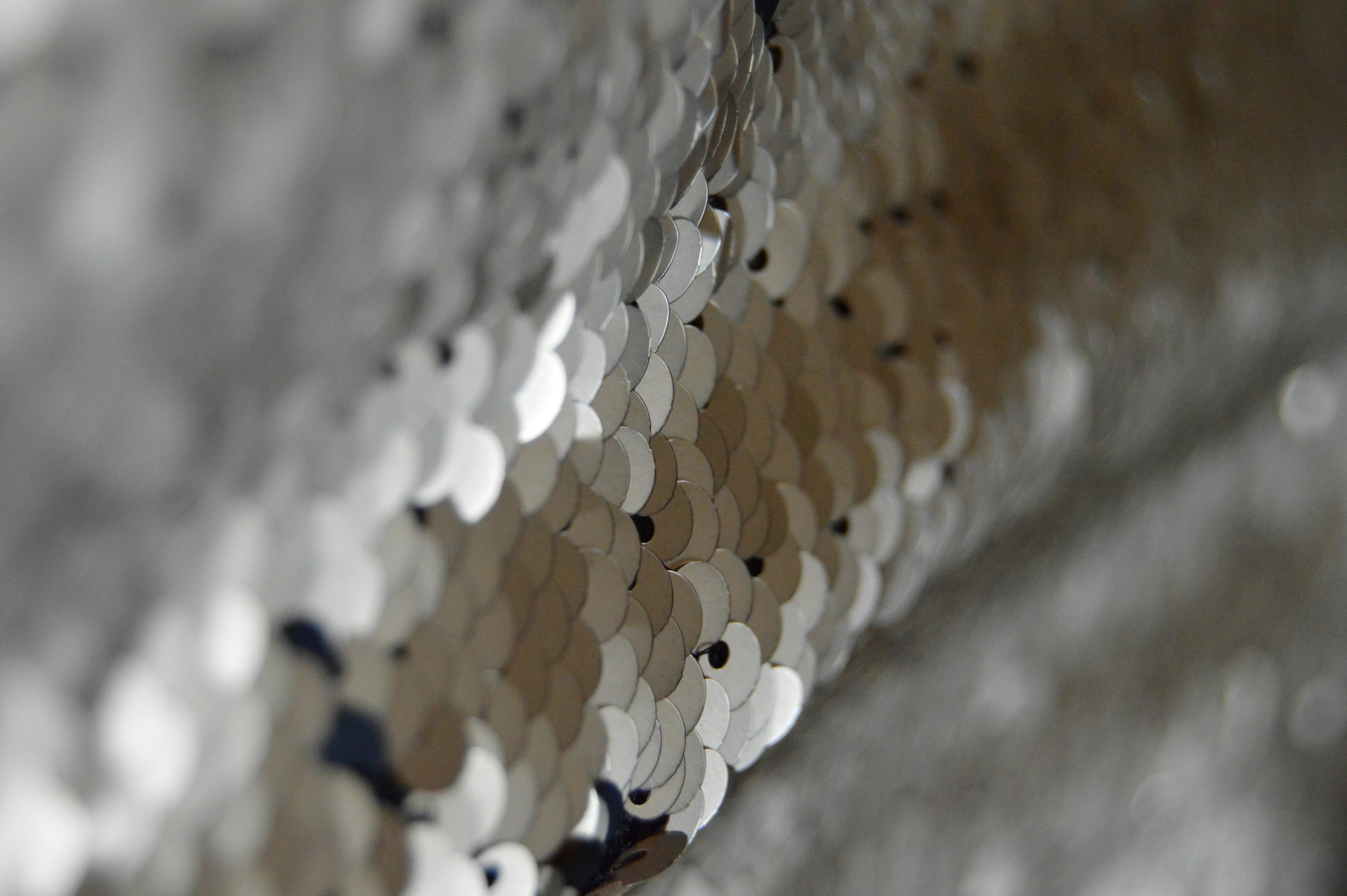 A collage of performance fabrics like moisture-wicking polyester, four-way stretch spandex, and breathable mesh.