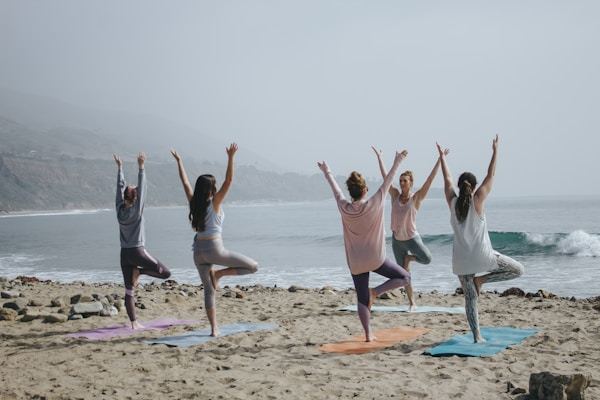 Yoga practitioner in flow class wearing high-waist leggings