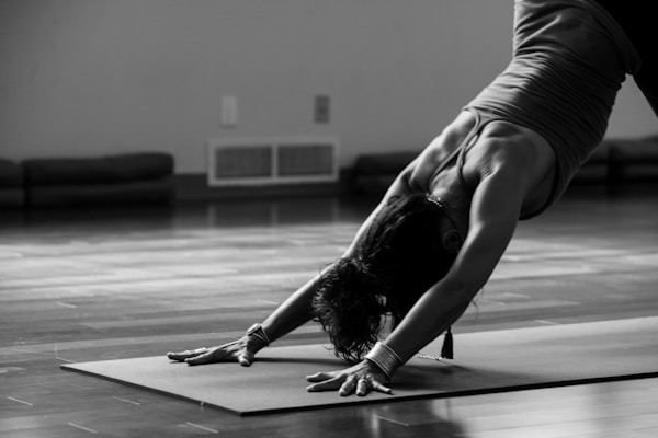 Aerial yoga practitioner in full coverage activewear