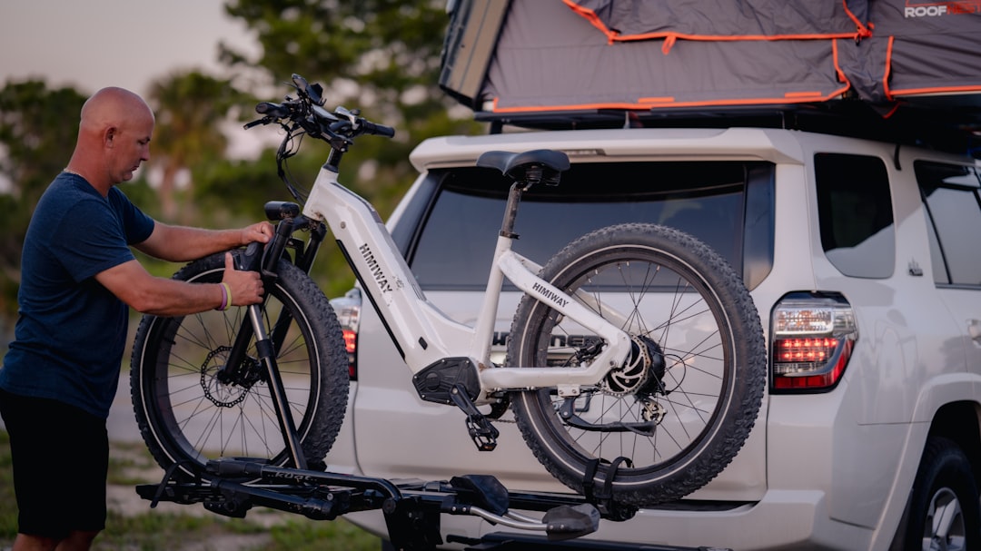A sleek, integrated lithium-ion battery pack on an electric dirt bike