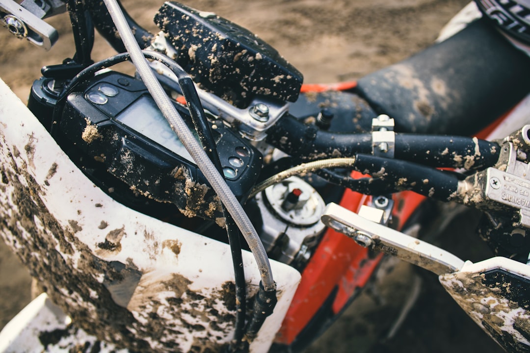 Close-up of an electric dirt bike's rear suspension and motor