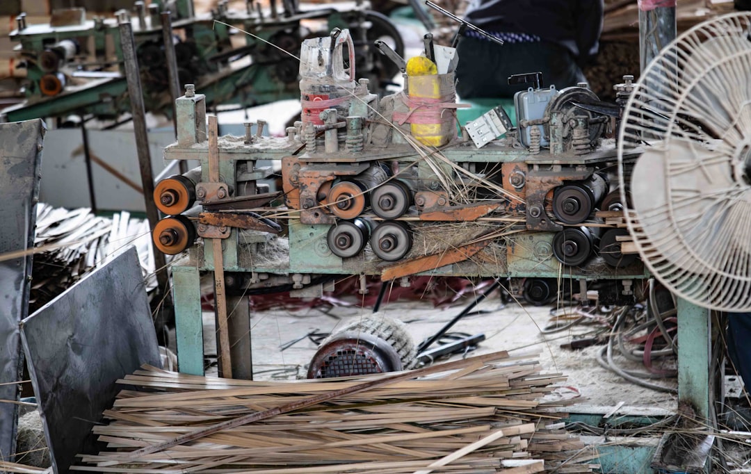 Factory worker assembling an electric bike on a production line
