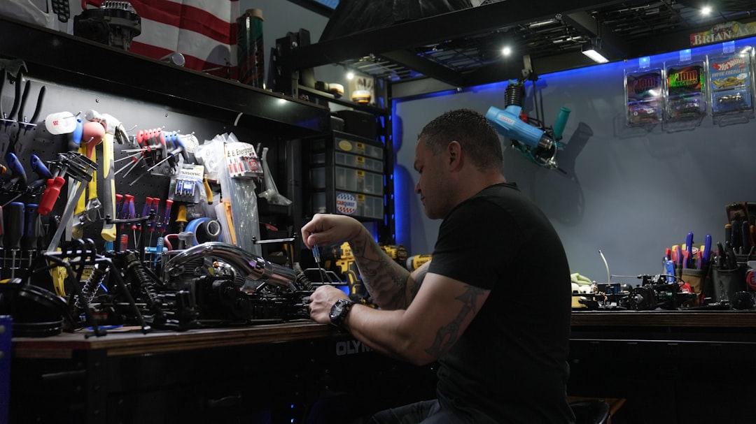 A technician servicing an electric bike in a clean, professional workshop