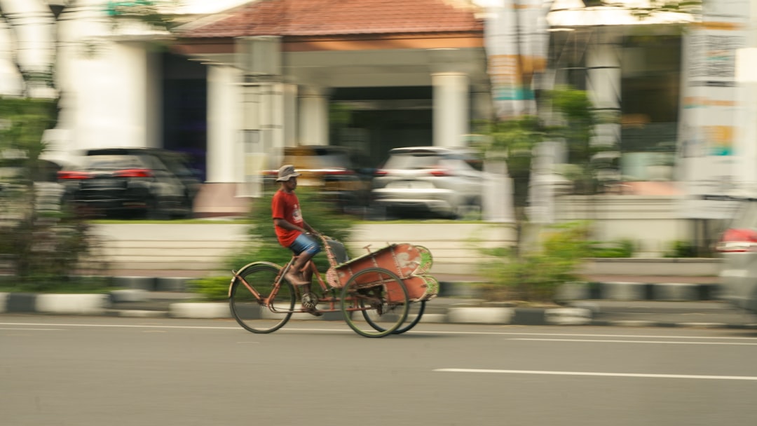 A rider wearing a DOT-certified helmet and full protective gear on an electric dirt bike.