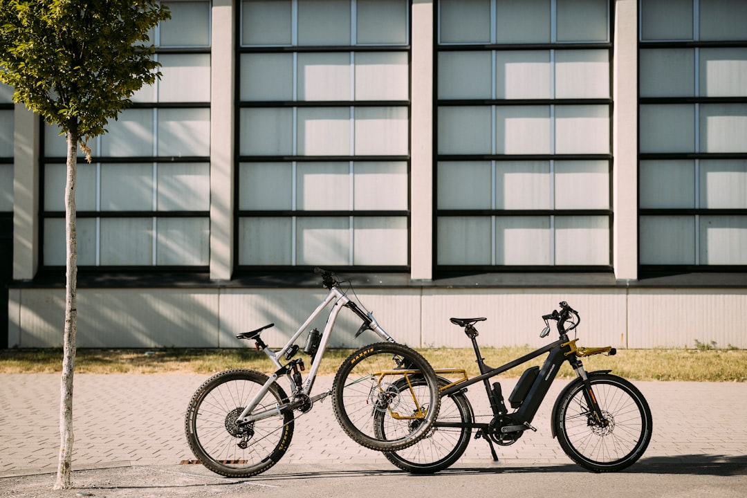 An electric bicycle and an electric dirt bike side-by-side to highlight differences