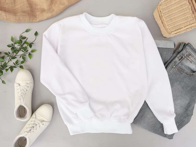 Custom hoodie flat lay with sneakers