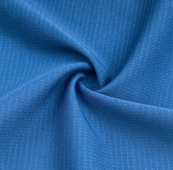 Sport fabric with double-sided laminated breathable perforations