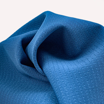 Sport fabric with double-sided laminated breathable perforations
