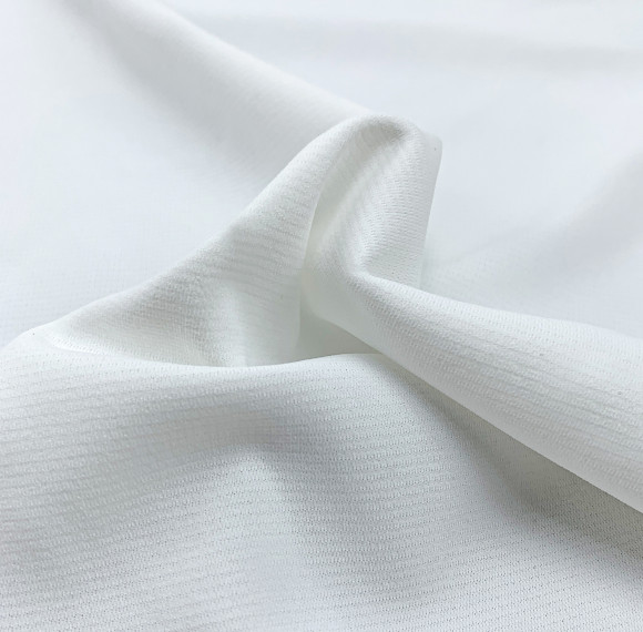 Tejido texturizado ligero 100% poliéster para camisetas deportivas y polos.