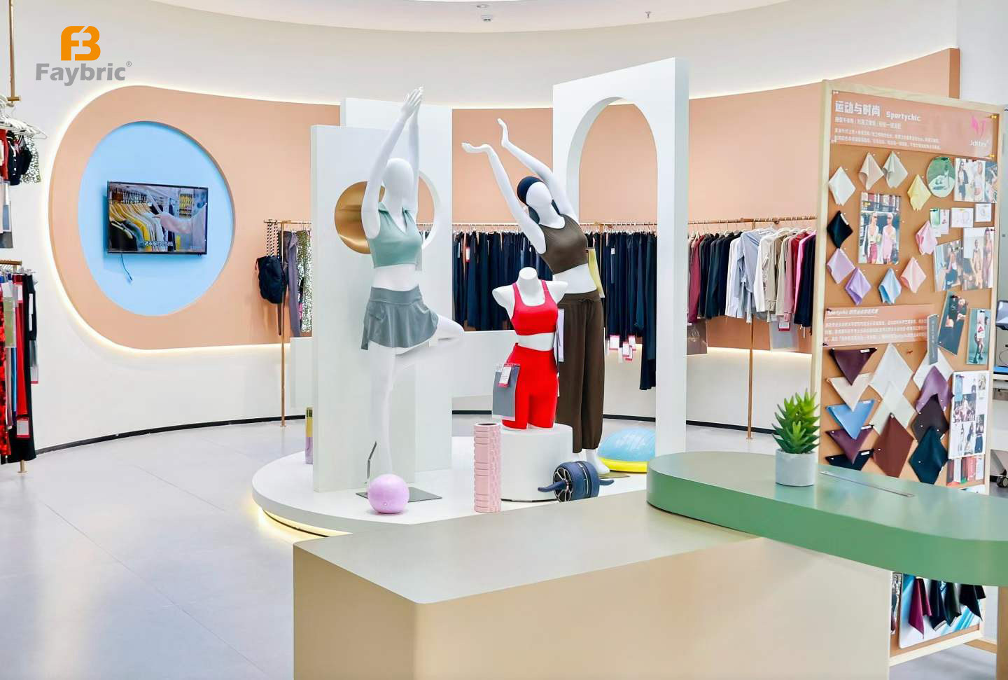 Faybric Jdttex modern showroom displaying functional sportswear fabrics and apparel samples