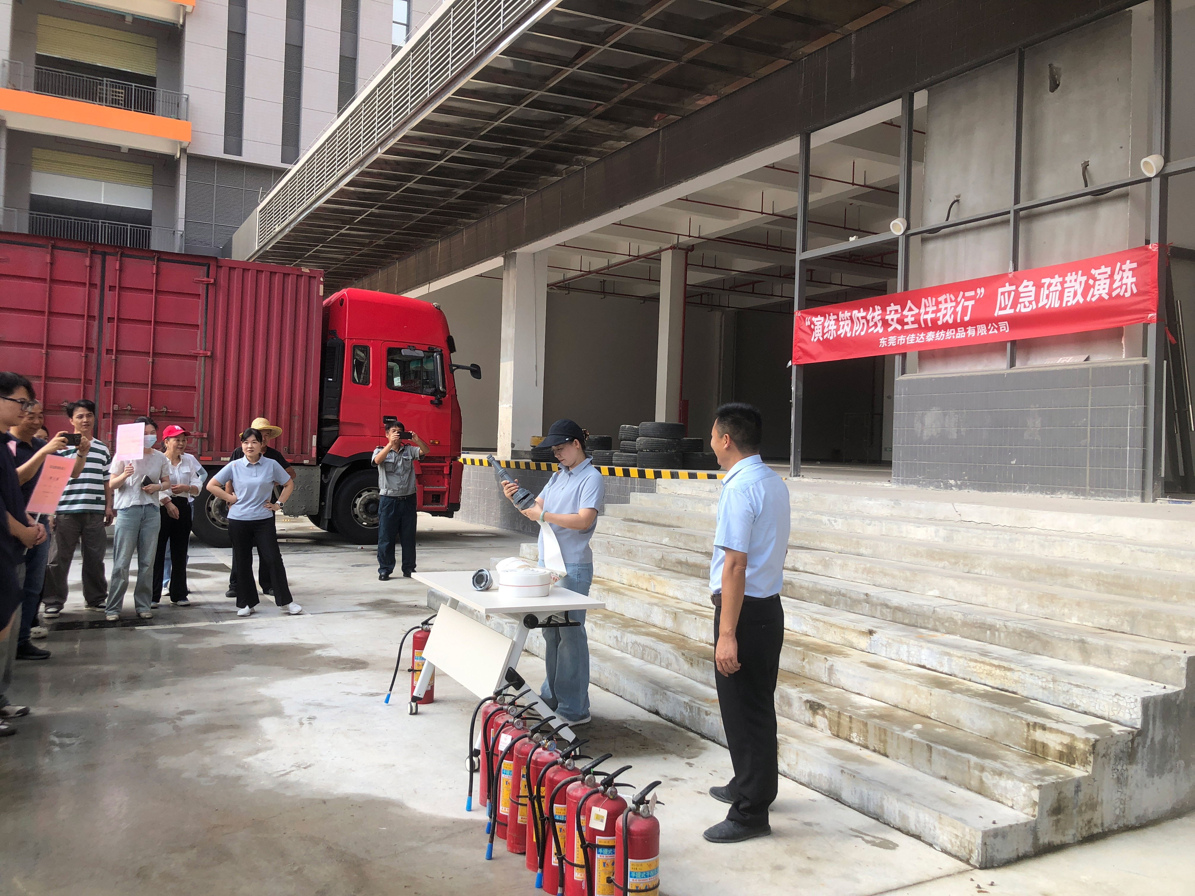 Group employees watched a training demonstration on fire hydrants and fire extinguishers at the Chia-Ta-Tai Textile Factory.