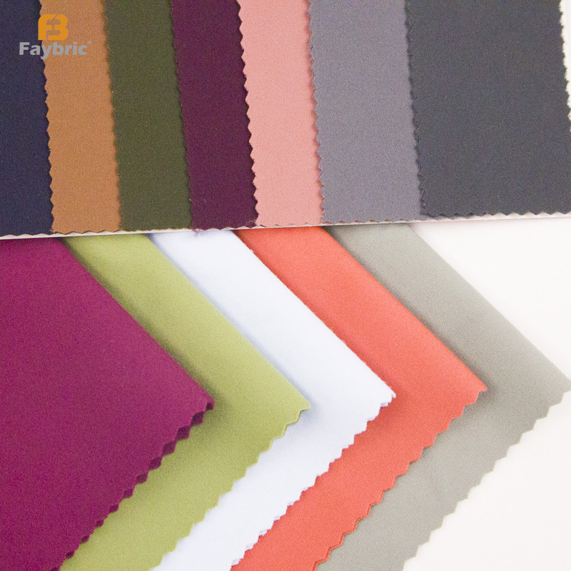 Multi color solid swatch cards of brushed stretch knit fabric for fall yoga thermal base layer clothing