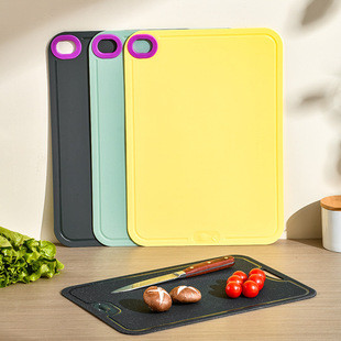 Branded ChopAid TPU magic cutting boards in multiple colors, stacked neatly with company logo visible
