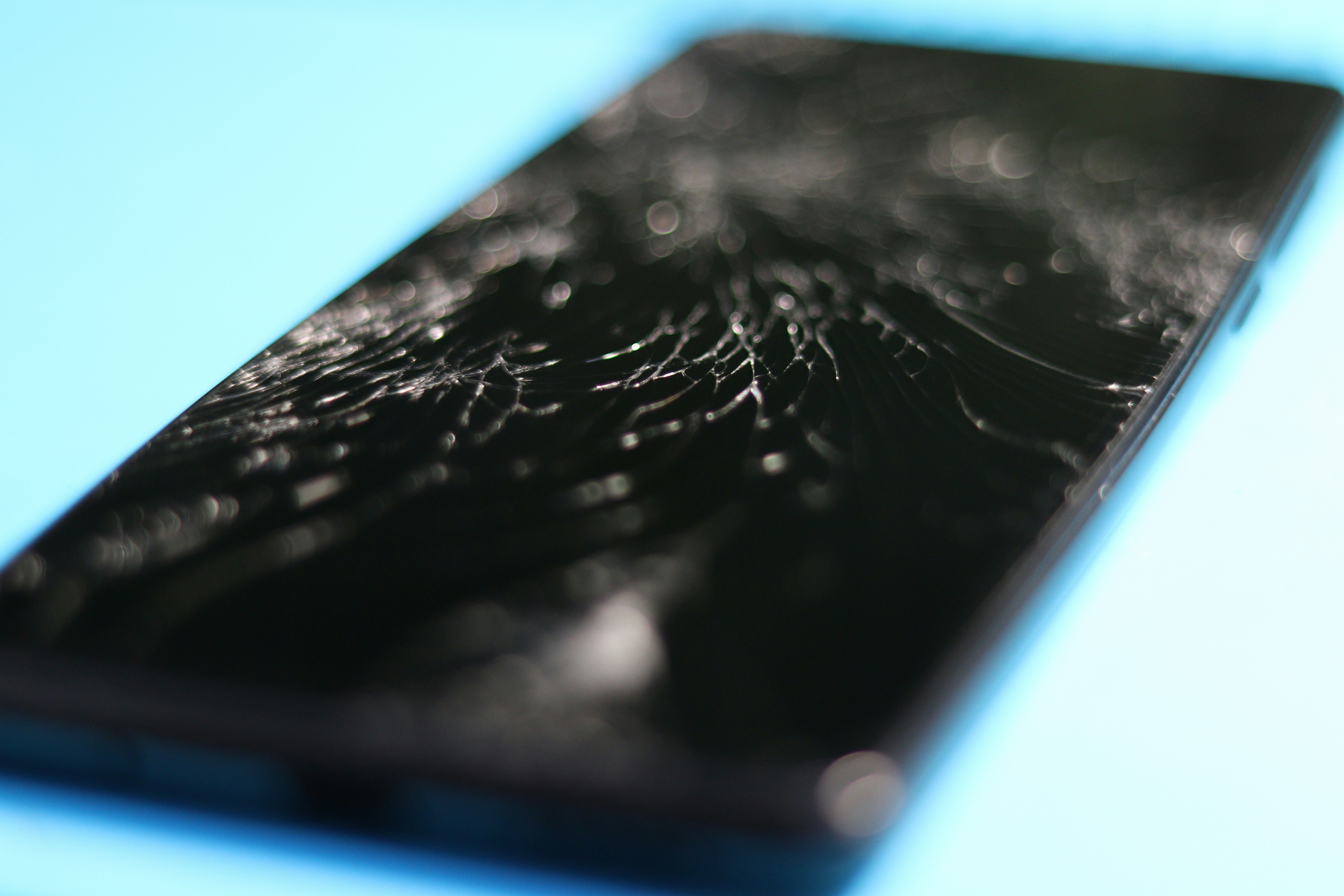 A close-up of the textured surface of a black HDPE plastic cutting board, showing its resilience.