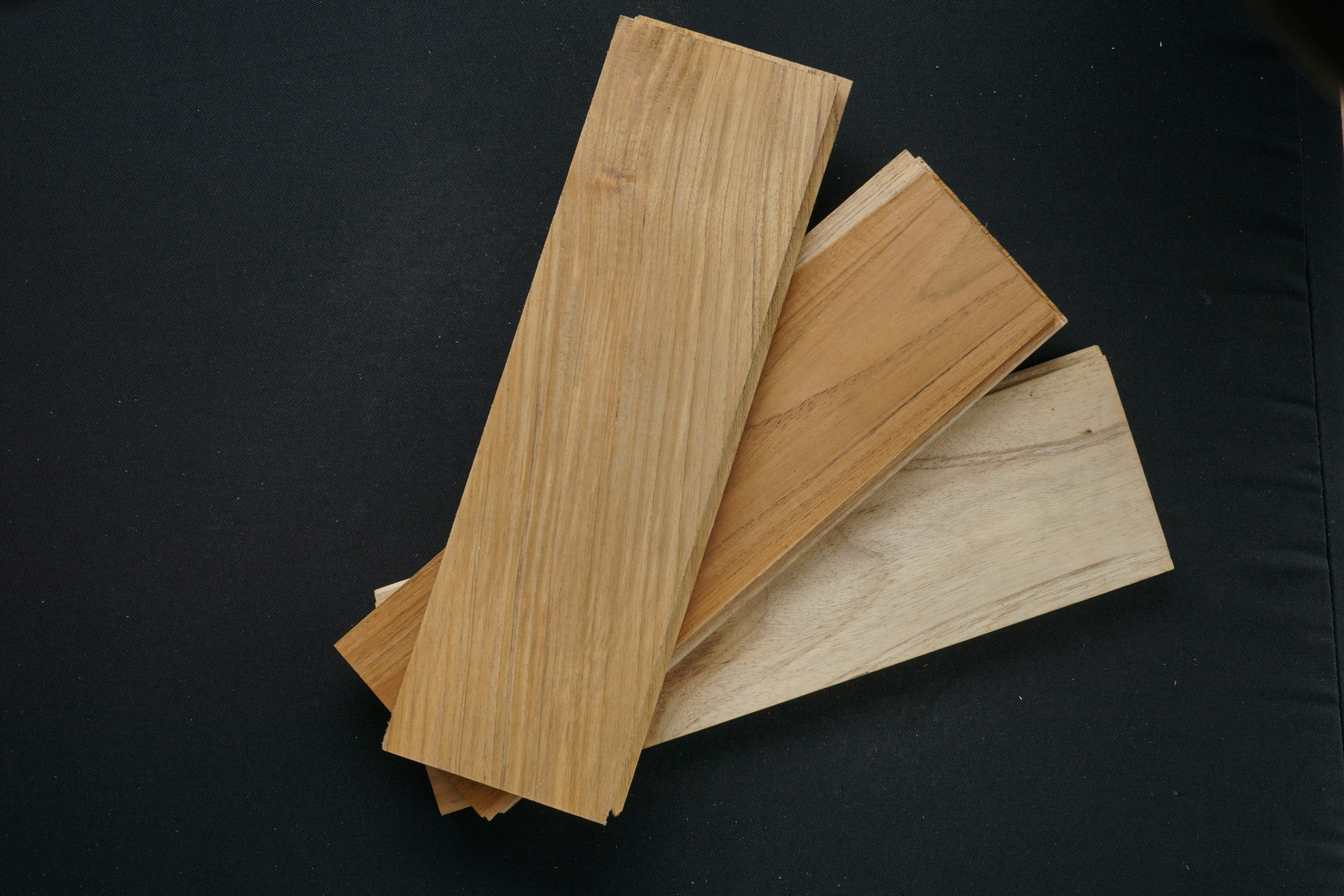 A beautiful wooden cutting board next to a bamboo cutting board, showing natural material alternatives.