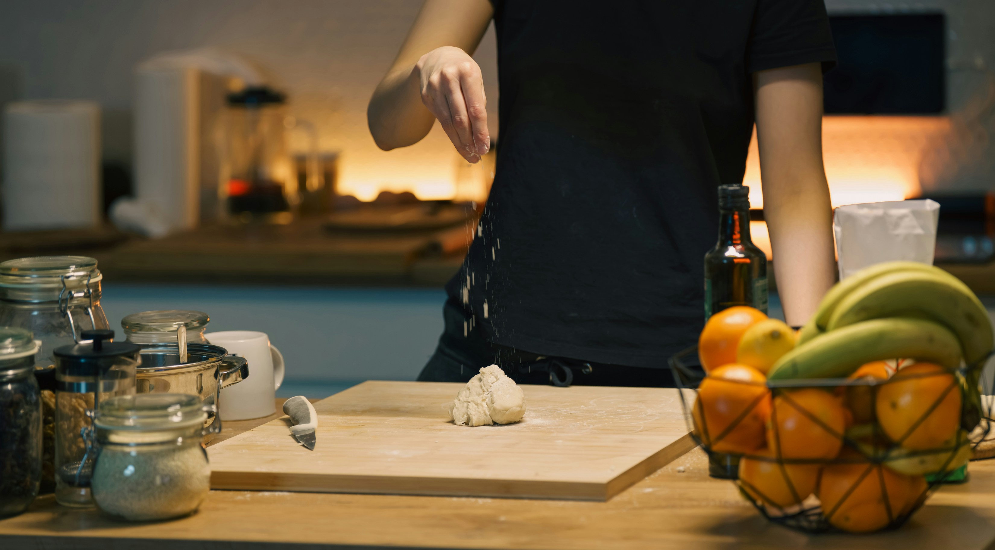 A lightweight plastic cutting board being easily moved around a kitchen
