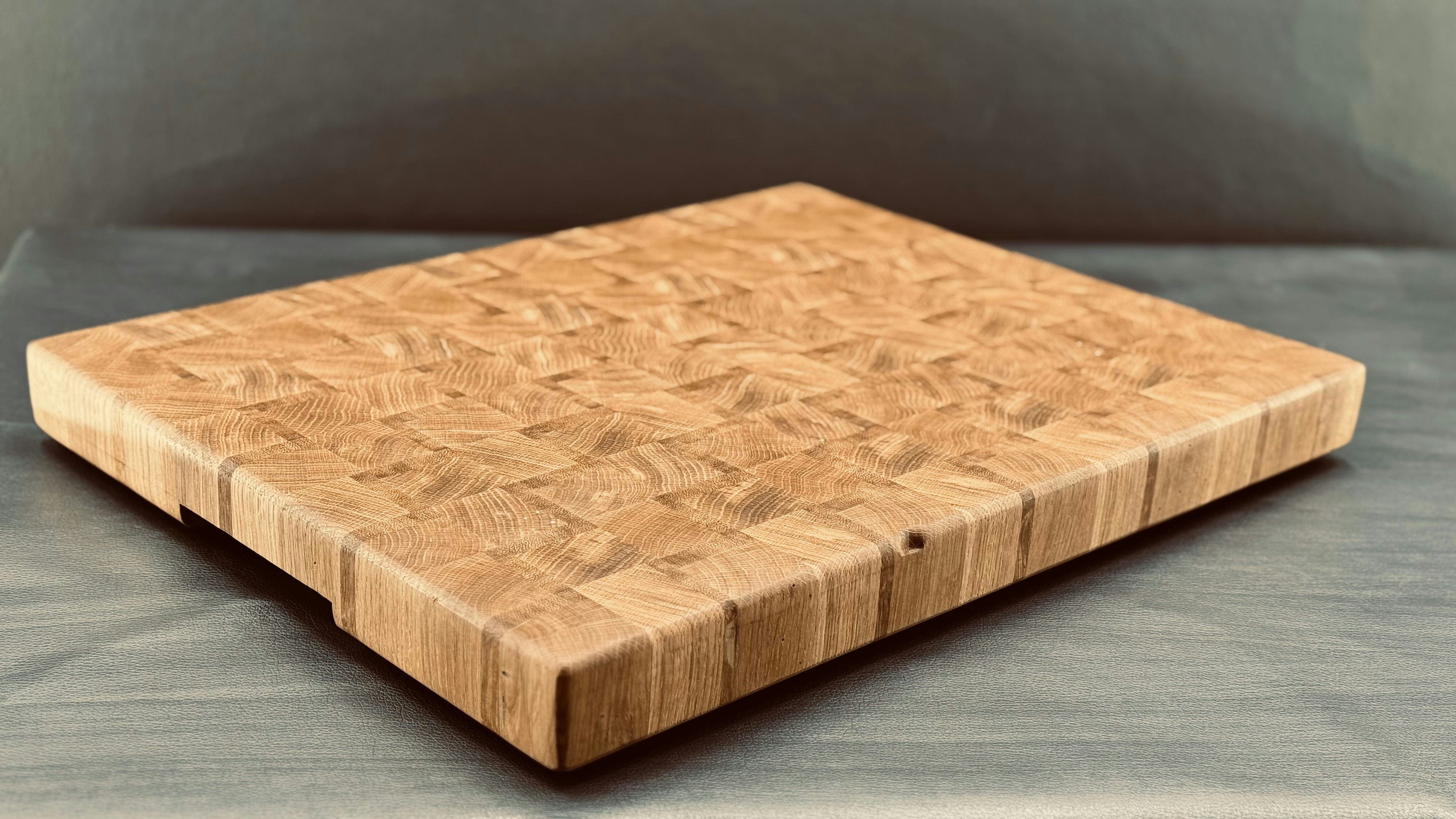 A heavily scored and stained plastic cutting board.
