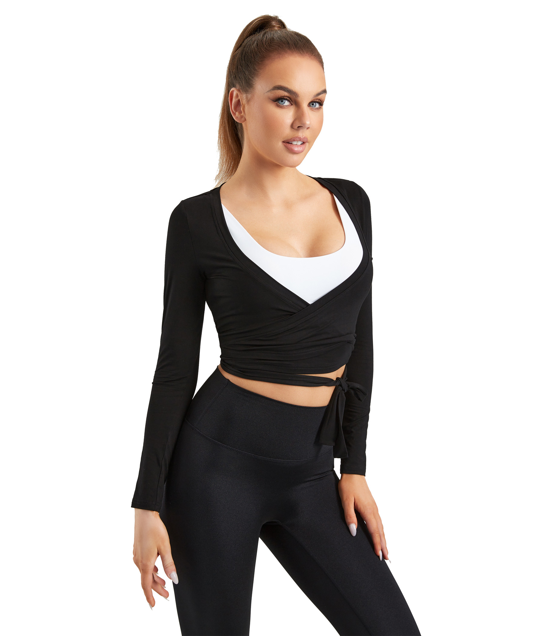 White scoop sports bra + black wrap-front long sleeve top + sculpted leggings