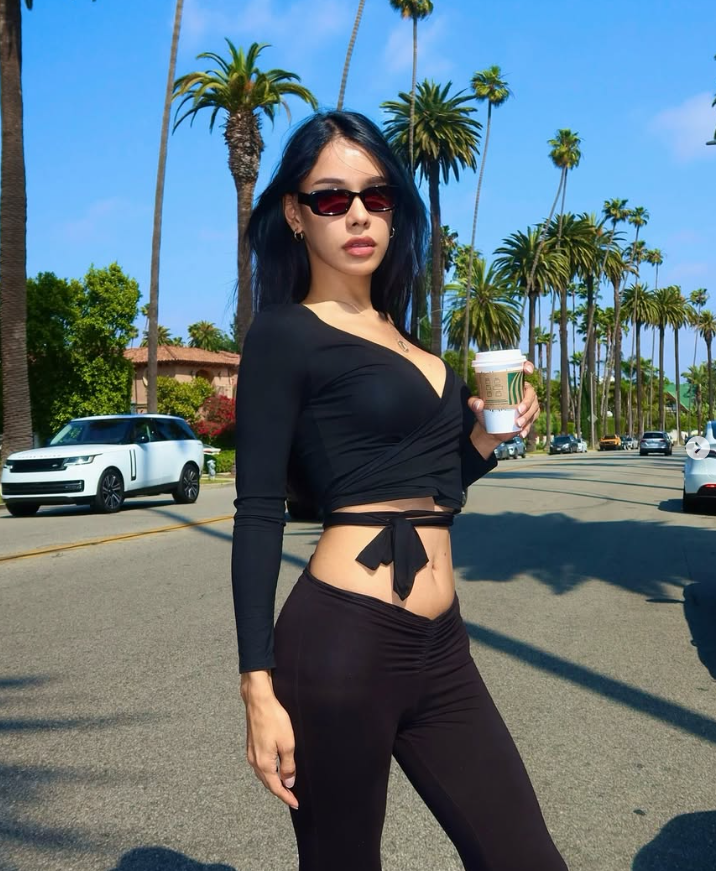 Chic black activewear outfit styled for casual streetwear