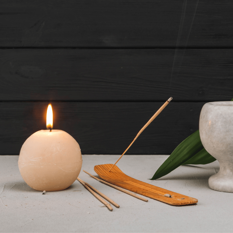 Burning bamboo incense stick on holder