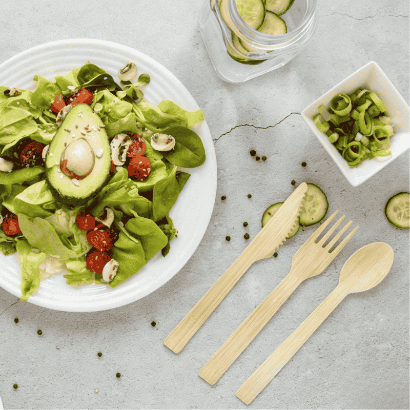 Disposable bamboo cutlery set with fresh salad