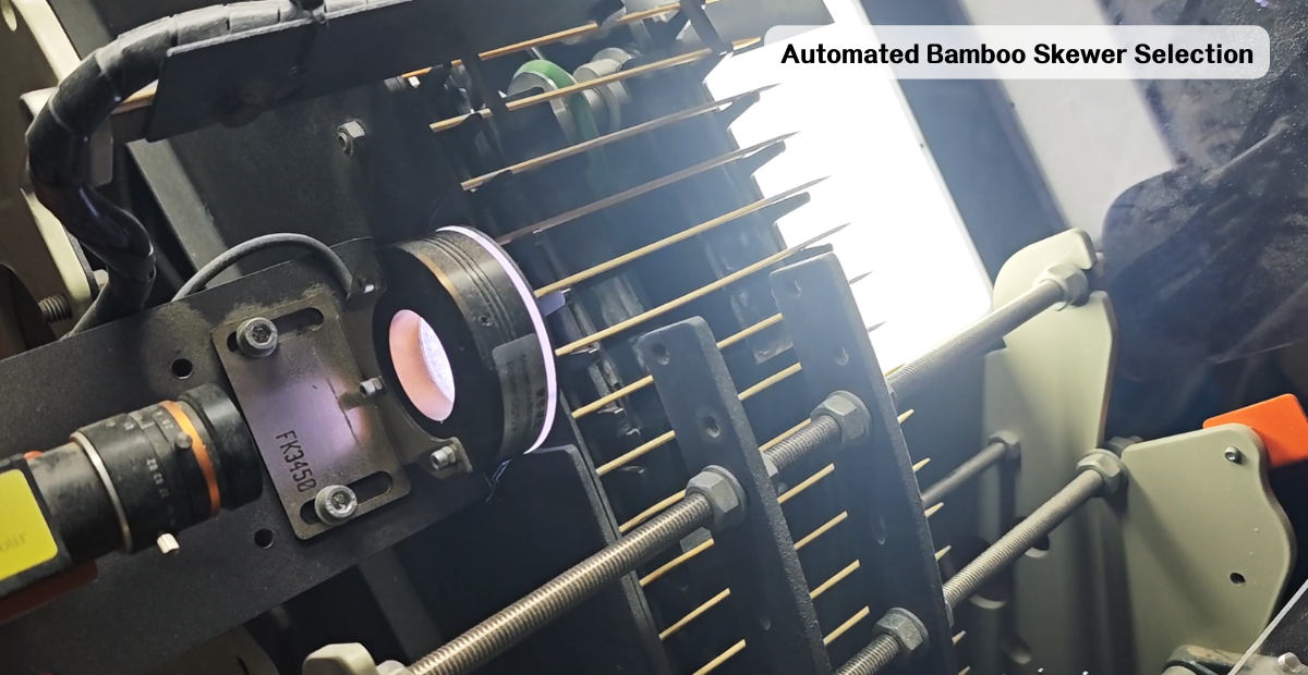Automated bamboo skewer selection machine sorting skewers for straightness and diameter on a production line