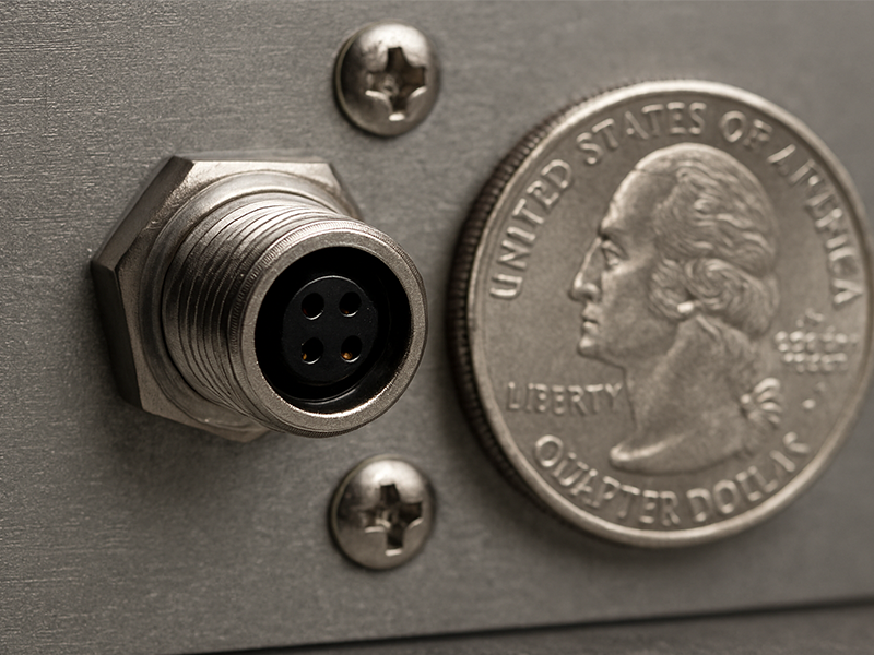 The M9 circular connector is installed on the industrial panel.