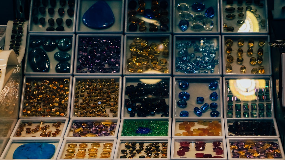 Laptop screen showing a B2B wholesale jewelry marketplace with various sterling silver items.