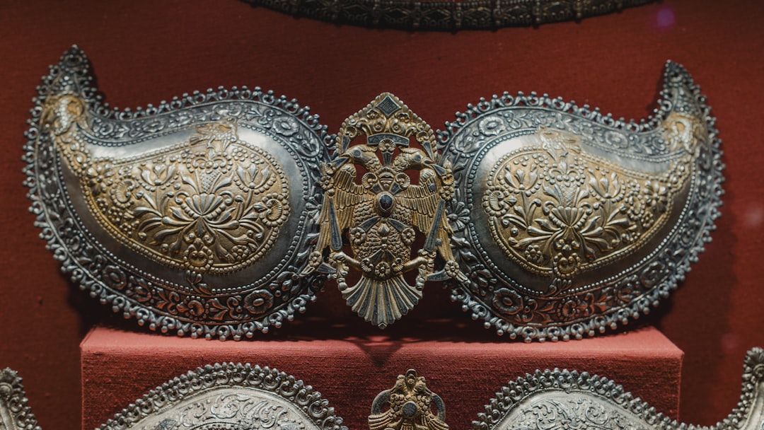 A collection of ethically sourced sterling silver jewelry pieces displayed on a rustic wooden background