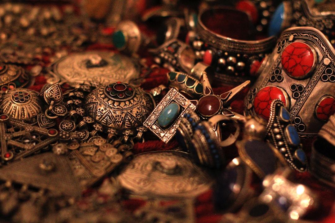 A collection of various sterling silver rings and necklaces neatly arranged