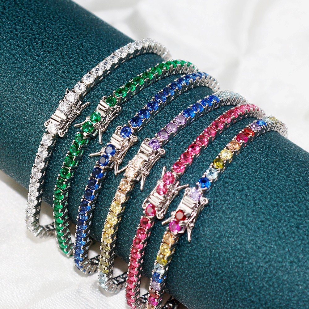 Close-up of colorful tennis bracelets with visible clasps and settings