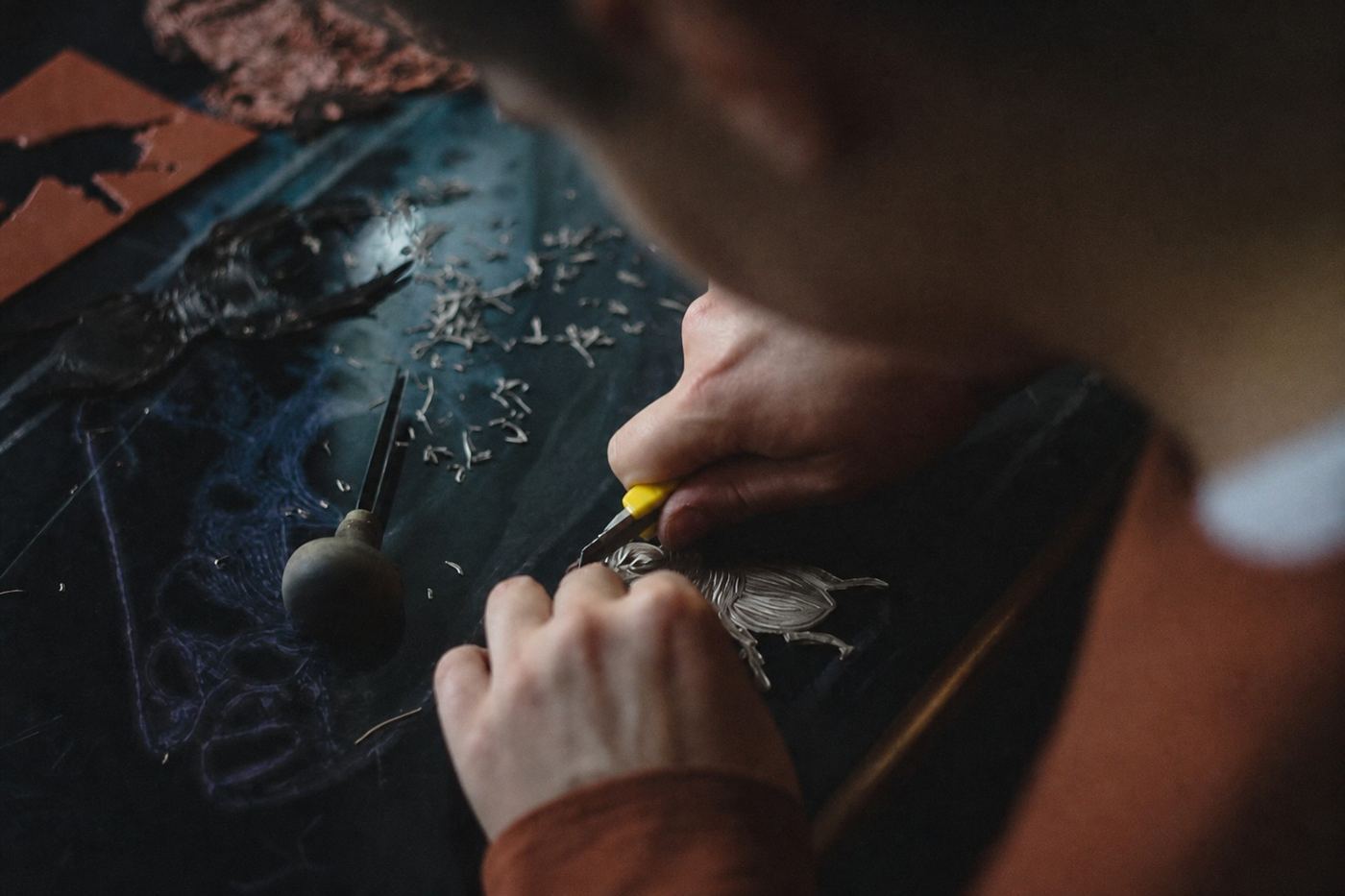 Silver jewelry being crafted in a jewelry workshop