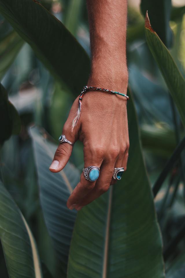 Silver-colored rings worn on a hand
