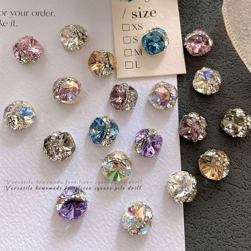 Geometric jewelry trend featuring diamond ball charm