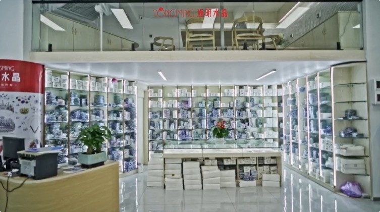 Step-by-step application of glass drill accessories to evening gown with professional tools