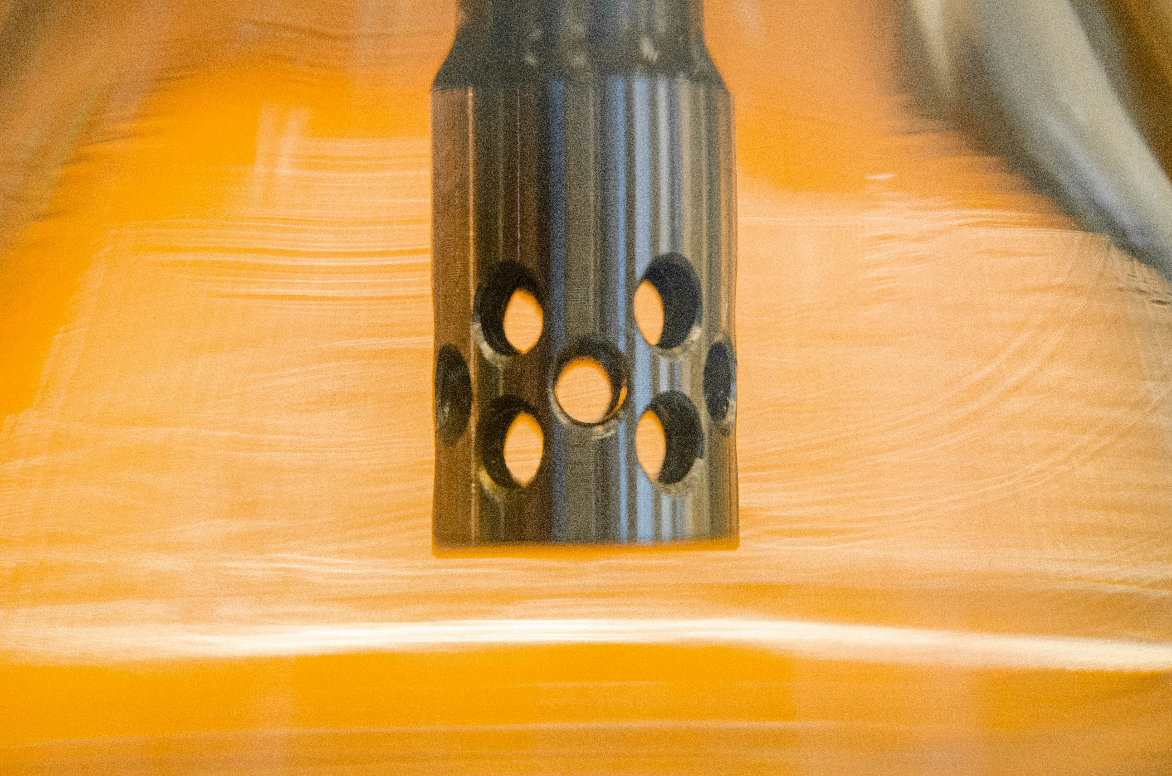 A close-up shot of various automotive rubber tubes and hoses connected to an engine.