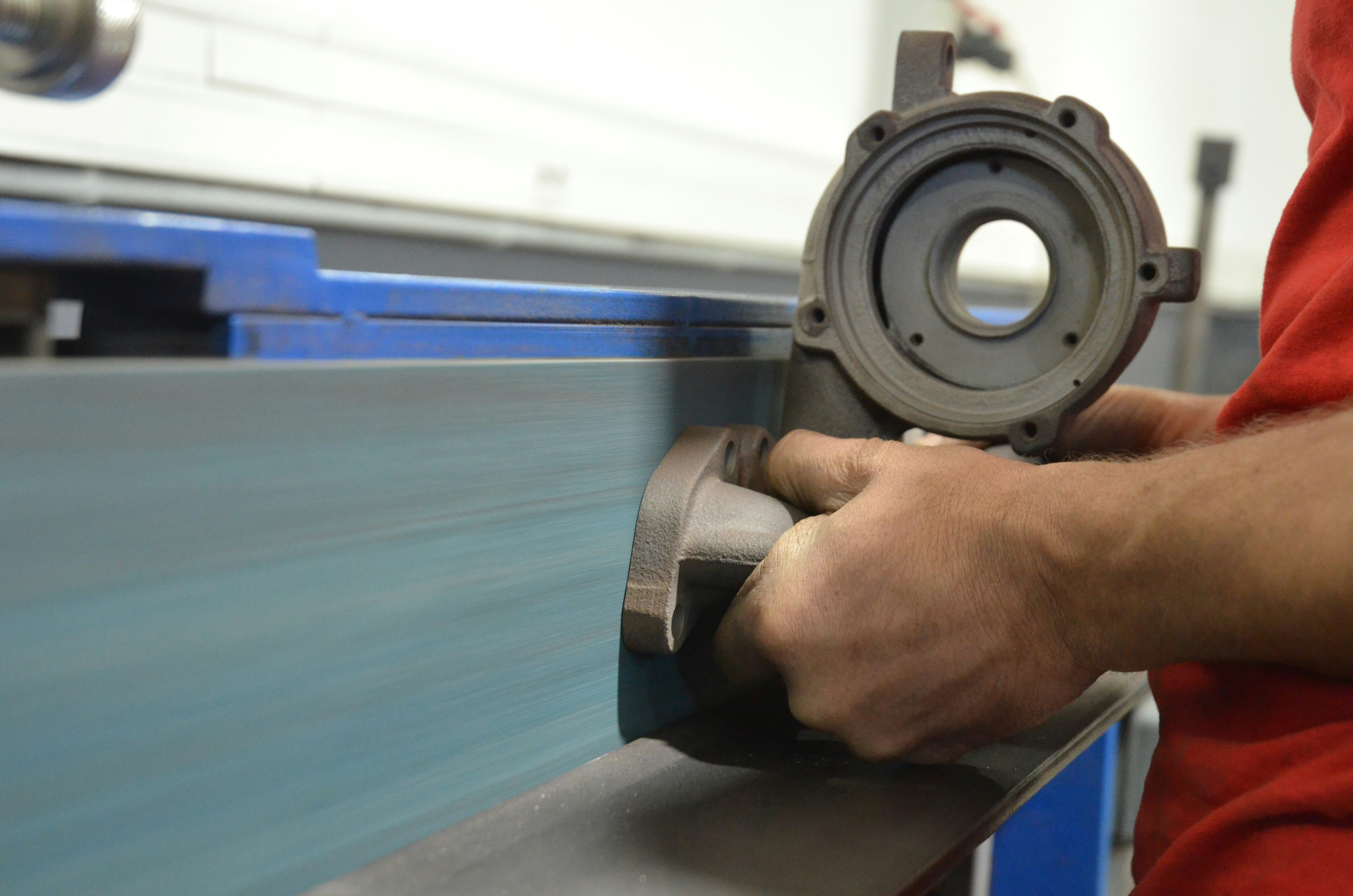 Quality Control for Custom Extruded Rubber Profiles A complex custom extruded rubber profile being inspected for quality