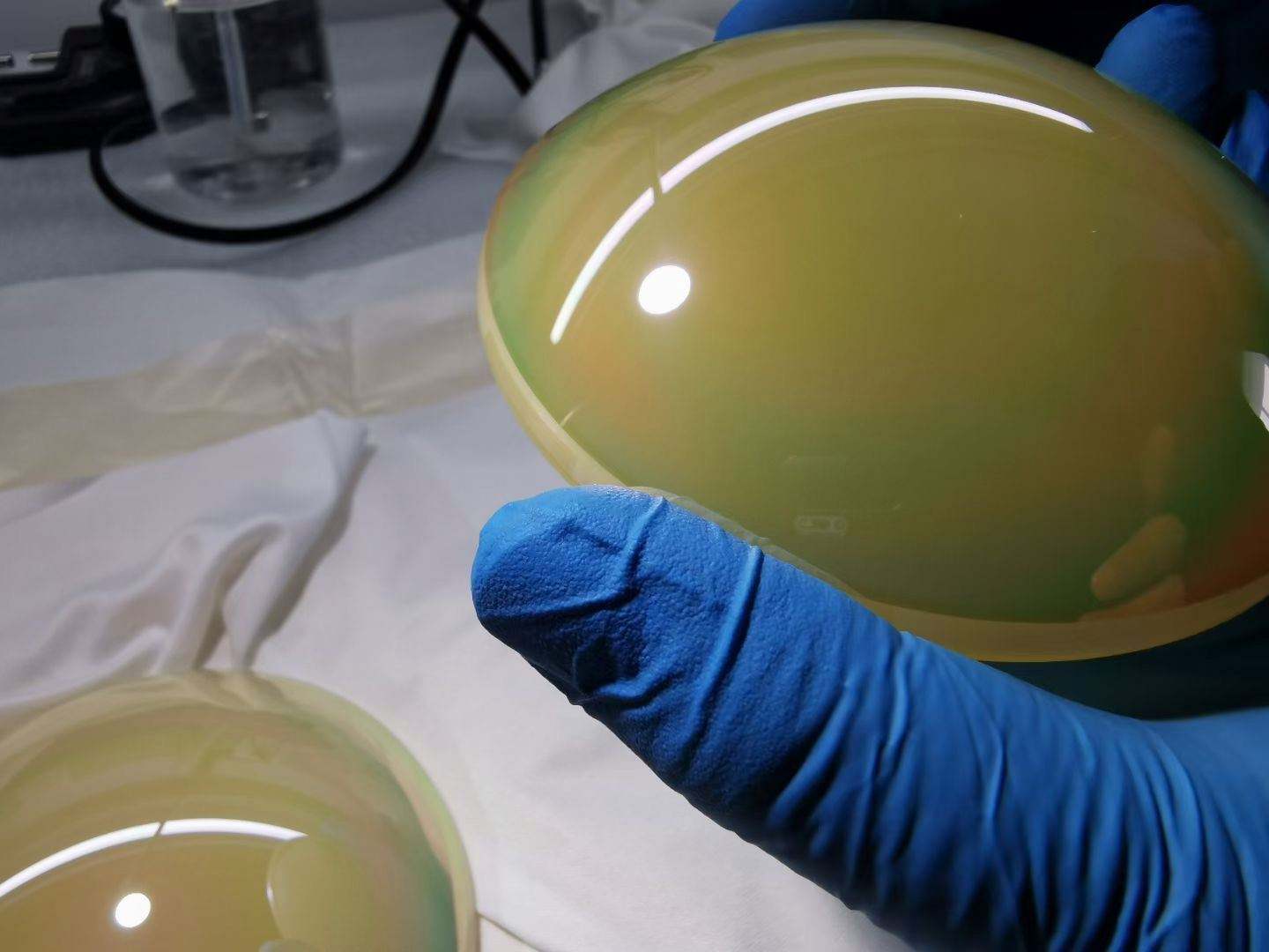 ZnS infrared optical dome inspection in cleanroom with nitrile gloves