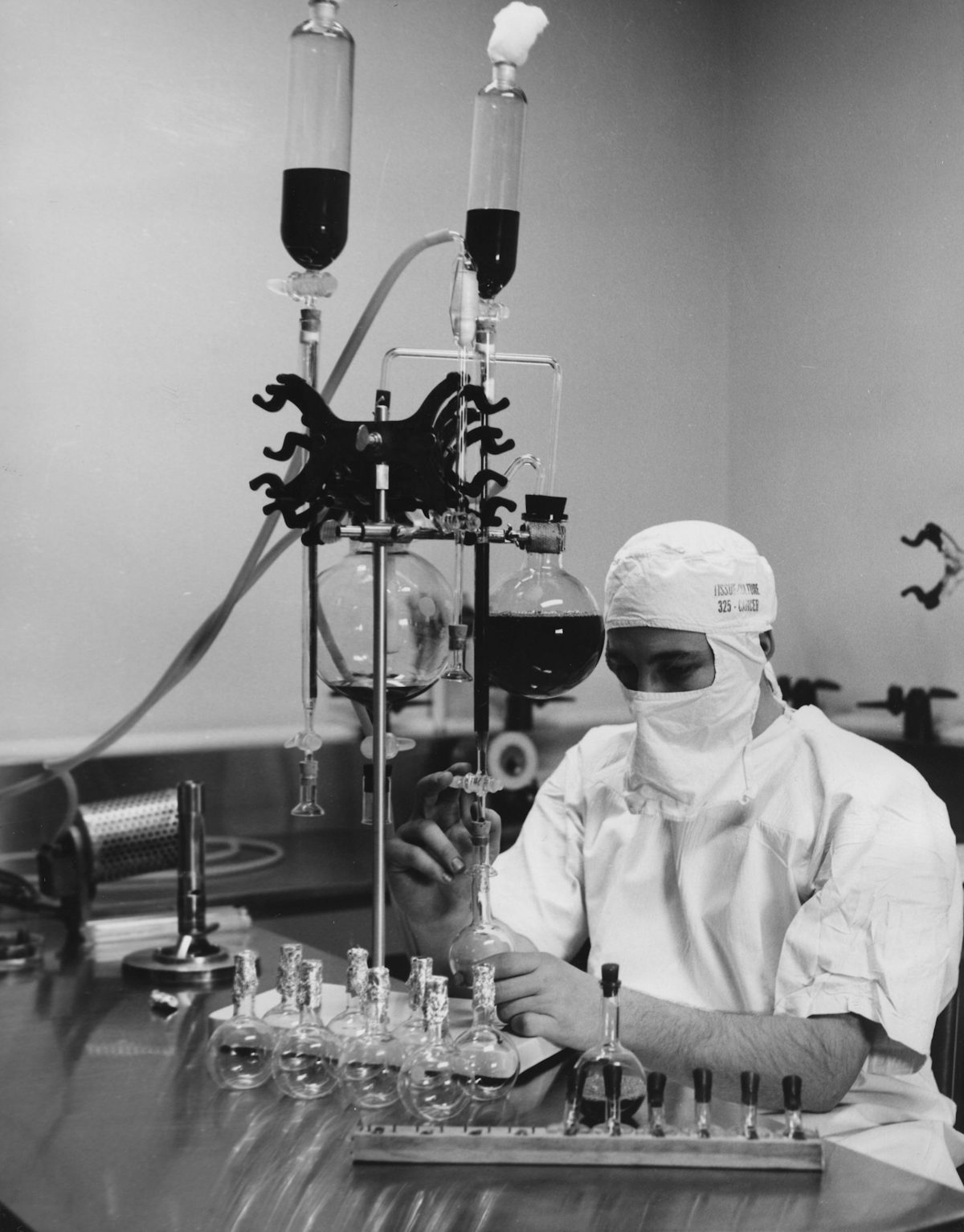Engineer evaluating custom BK7 glass dimensions and optical tolerances