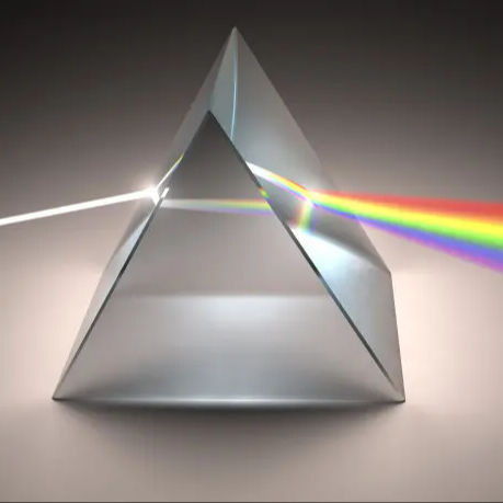 N-BK7 triangular prism splitting white light into visible color spectrum optical experiment