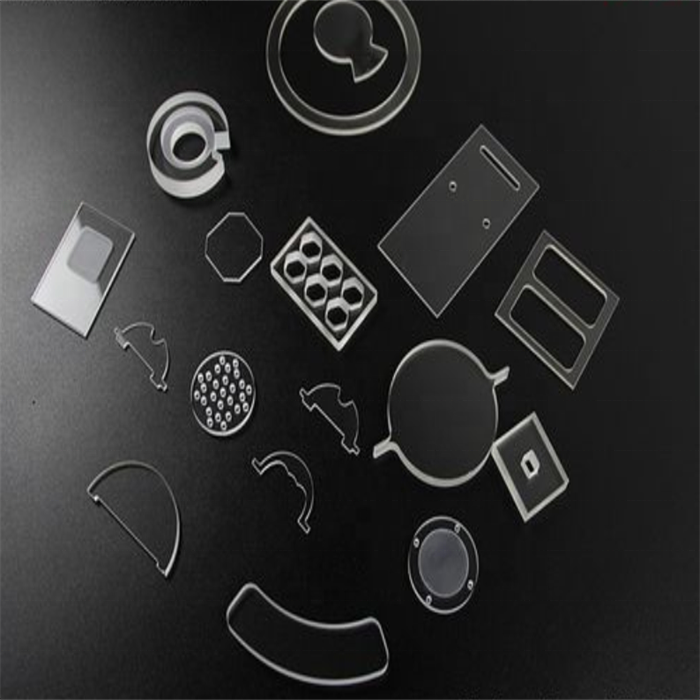 Felix Glass custom CNC machined quartz glass components with holes, irregular polygon and curved cutouts for optical and laboratory applications