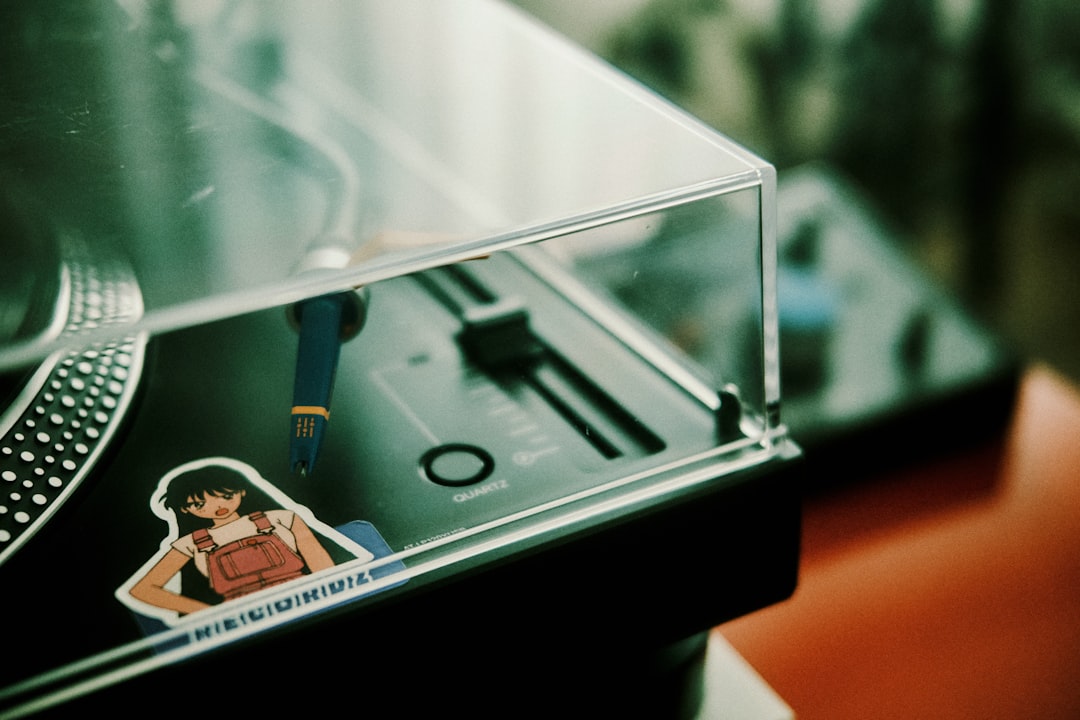 An acrylic booster box display case prominently features a collectible card box.