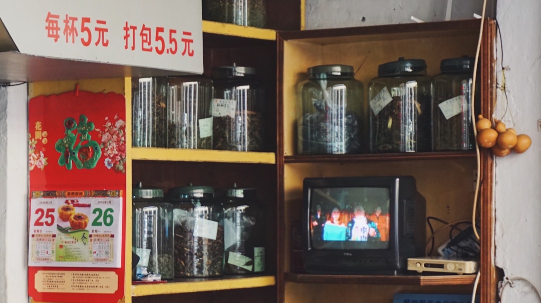 A stack of acrylic display cases, each holding a different collectible item.