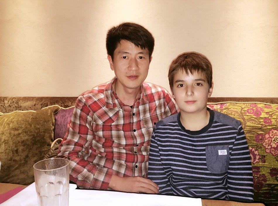 Jonny with FOT owner's son at family dinner during 2015 visit to Eastern Europe