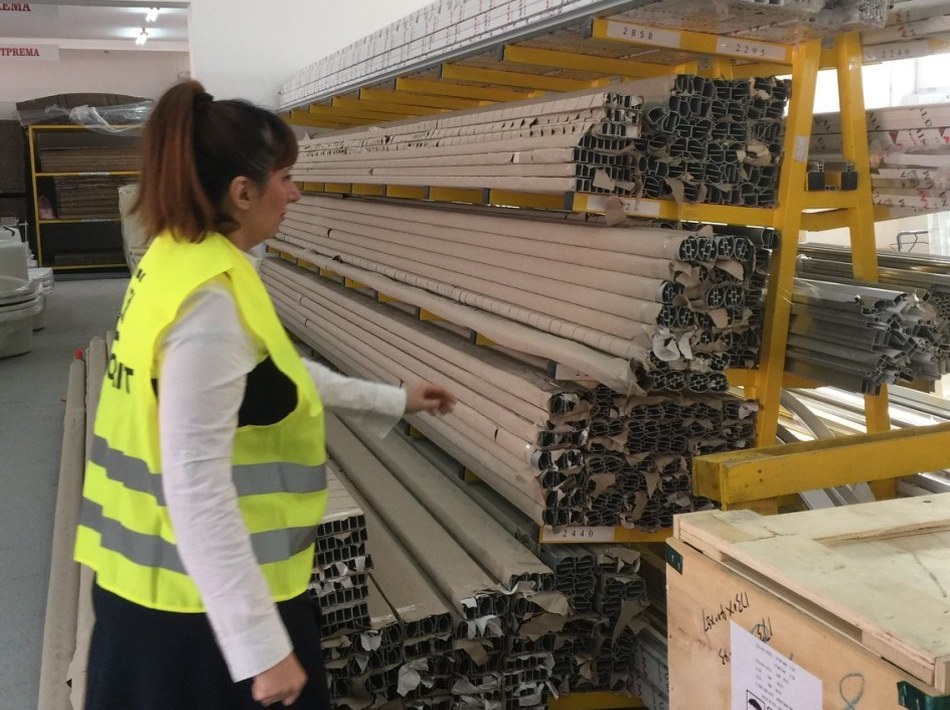 Worker inspecting goods on the rack