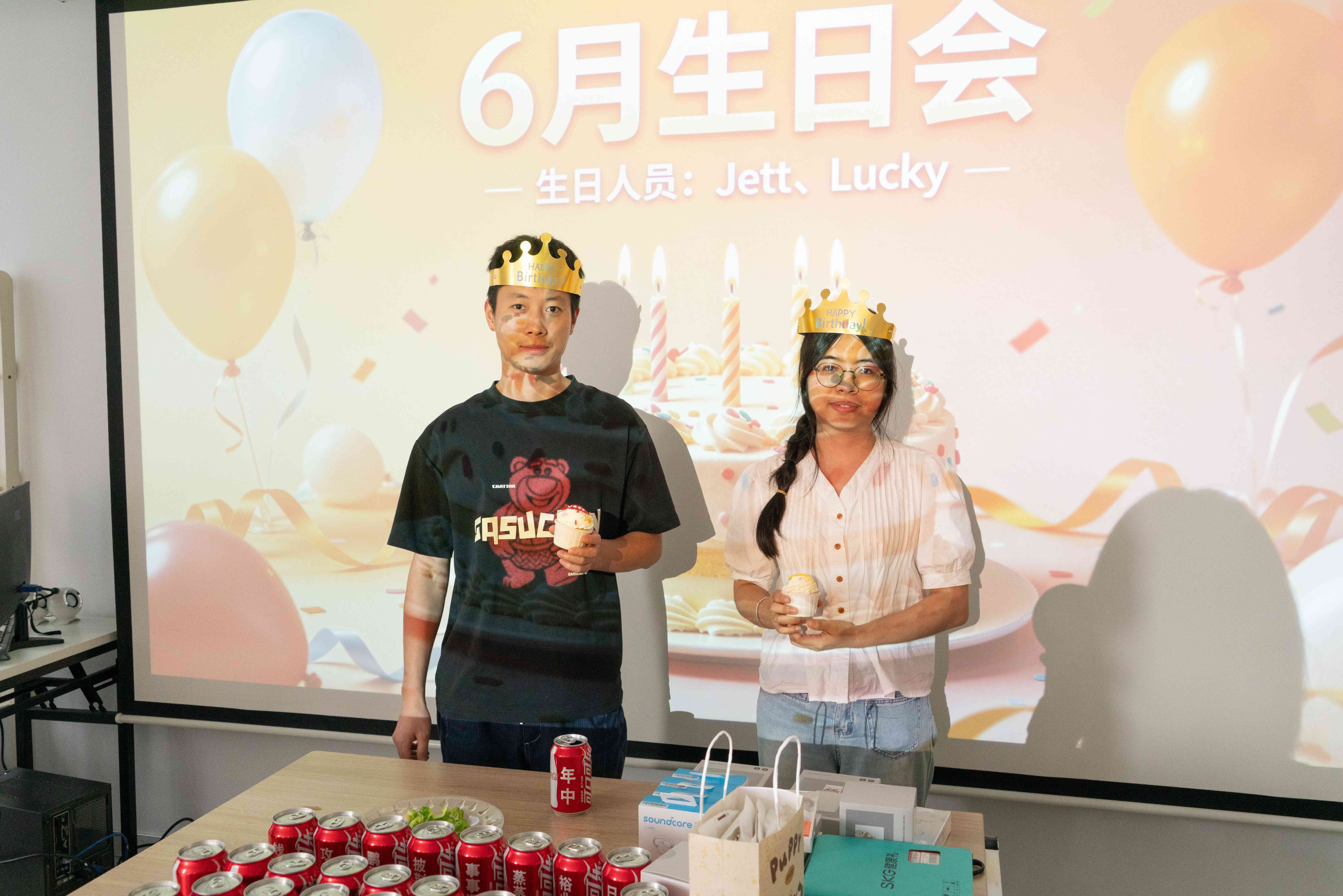 June birthday employees receiving custom cakes at Proway anniversary event