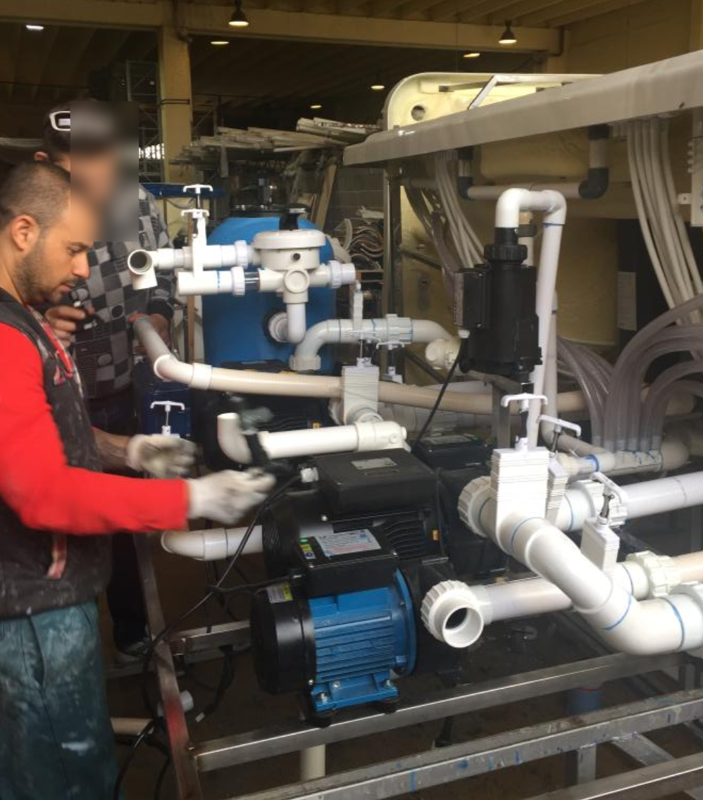 SPA external circulation system with blue motor pump and filter at EEH factory