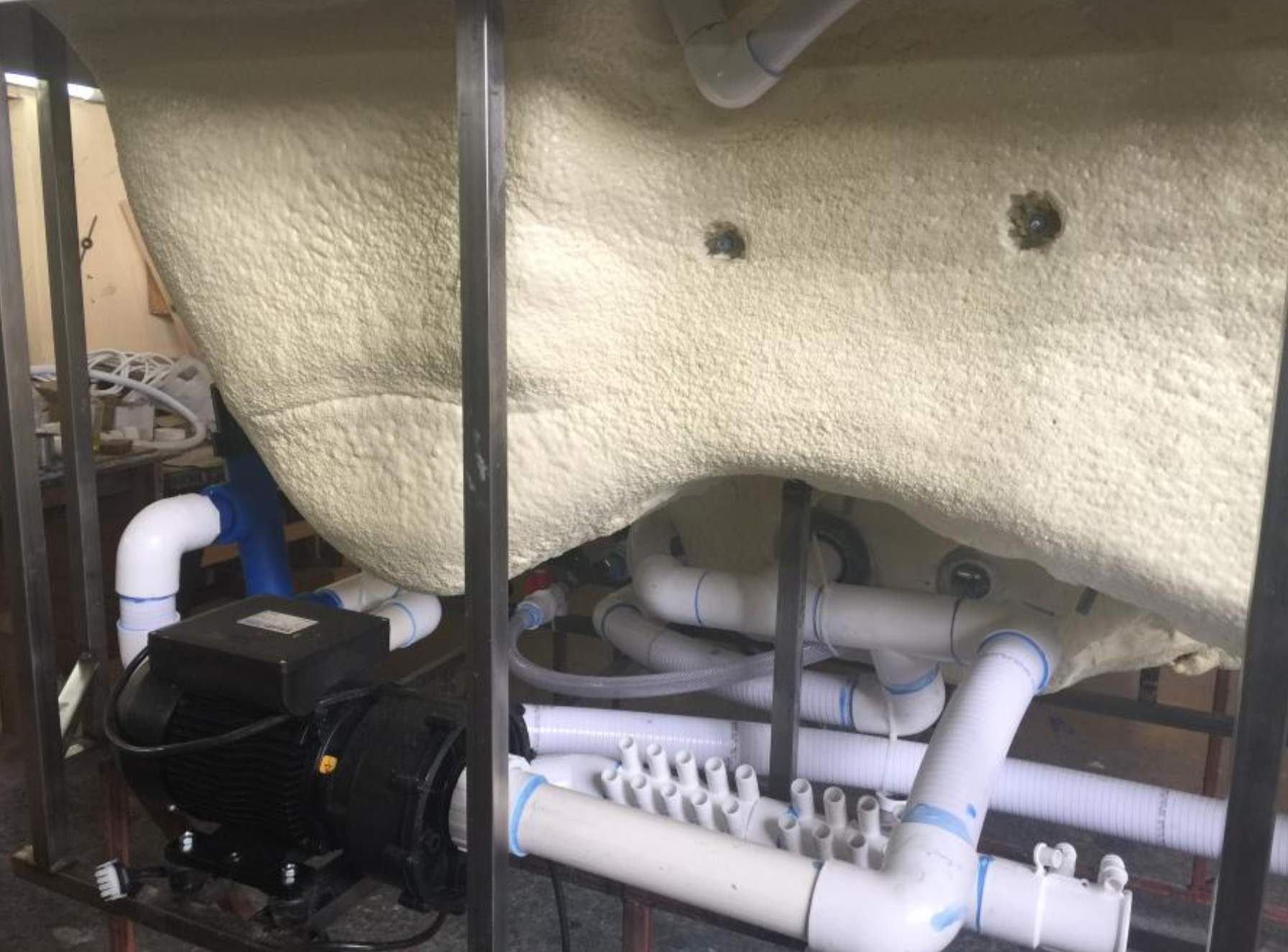 SPA underside plumbing system with motor pump and manifold at EEH factory