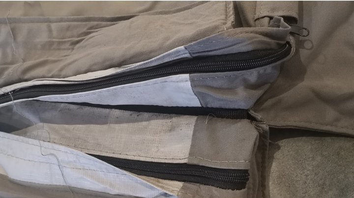 SEFM spa cover center seam zipper cross section showing dual zipper teeth and steam barrier layer